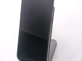 a cell phone that is sitting on top of a stand