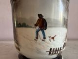 a vase with a picture of a man and a dog on it