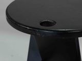 a close up of a black table with a hole in the top