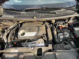 the engine of a car with its hood open and the hood down