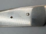 a knife that is laying on top of a table