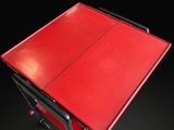 a red ping pong table on a black background