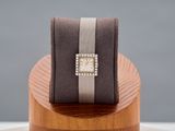 an image of a watch sitting on top of a wooden stand