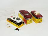 three toy cars that are sitting in a box