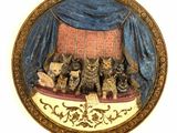 a picture of a picture of a group of cats on a bed