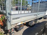 a truck that has a cage on the back of it
