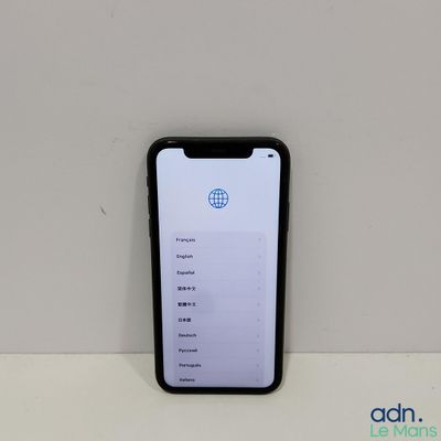 a close up of a cell phone sitting on top of a table