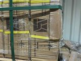 a large stack of boxes on a pallet in a warehouse