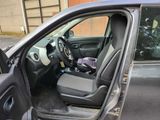 the interior of a car with the door open showing the driver ' s seat