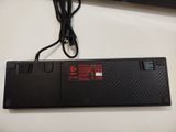 a black keyboard with a red light on it