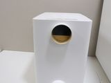 a small white box with a hole in it