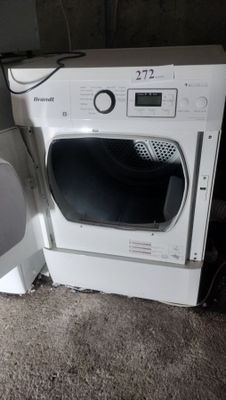 a white washer and dryer sitting next to each other on the floor