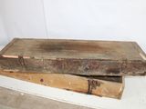 two old wooden boxes sitting on a shelf