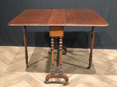 an old wooden table with two legs and a wooden top