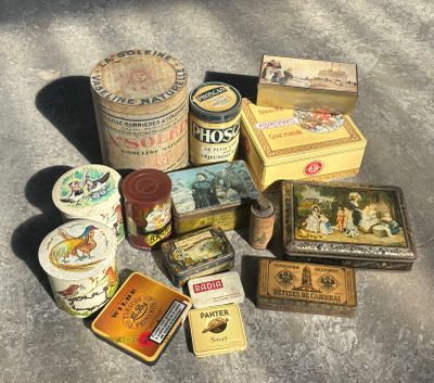 many different types of tins sitting on the ground