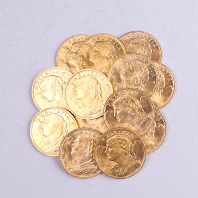 a pile of gold coins sitting on a white surface