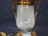 a lamp that is sitting on a table with a lamp shade on it