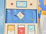 a blue box with a picture of a plane and a book