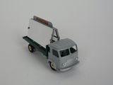 a toy truck that has a sign on the back of it