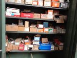 many boxes and other items on the shelves in the room