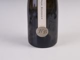 a bottle of wine that is sitting on a table