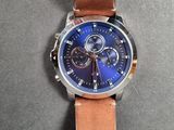 a close up of a watch on a table