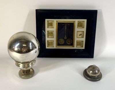 a picture of a silver ball and a picture of a clock on a table