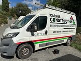 a white van that is parked on the side of the road