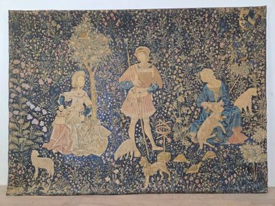 a tapestry hanging on the wall of a room
