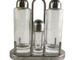 three salt and pepper shakers in a metal holder