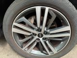 a close up of a tire on a car ' s rim
