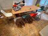 many chairs around a table in a room