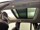a view of the sunroof from inside of a car