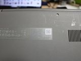 a laptop that has a sticker on the back of it