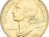 a close up of a coin with a woman ' s face on it