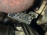 a close up of a motorcycle with a number plate on it