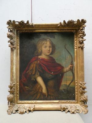 portrait d'un jeune garçon tenant un arc et une flèche, dans un cadre doré