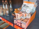 many empty bottles on the shelves in the store