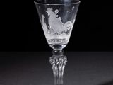 a wine glass that is sitting on a table