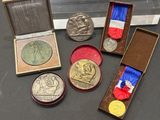 many medals and medals that are on display on a table