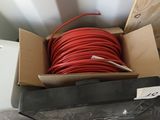 a box with a bunch of red wires inside of it