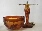 a bowl and a lamp sitting on a table
