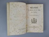 an open book with a picture of a coat of arms on it