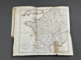 an old book with a map of france on it