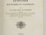 an open book on a white surface with a black and white image