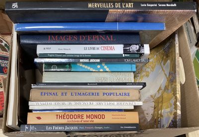 many books in a box on the table