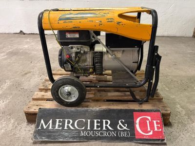 a small generator sitting on a pallet in a warehouse