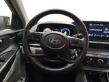 the interior of a car with a steering wheel and dashboard controls