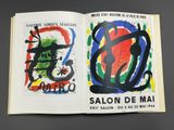 an open book with a picture of a painting on it