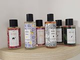 many different types of bath products displayed on a shelf